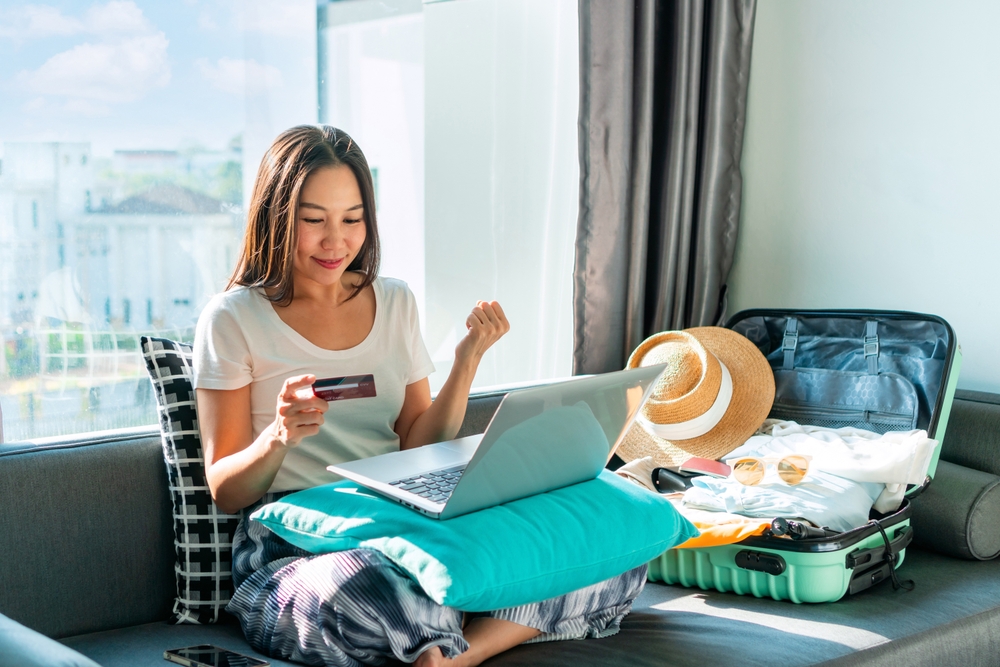 Woman booking flight for cheap flight day