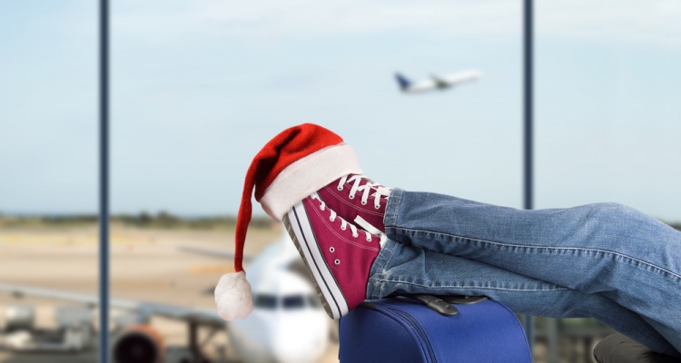 boy with santa hat in airport