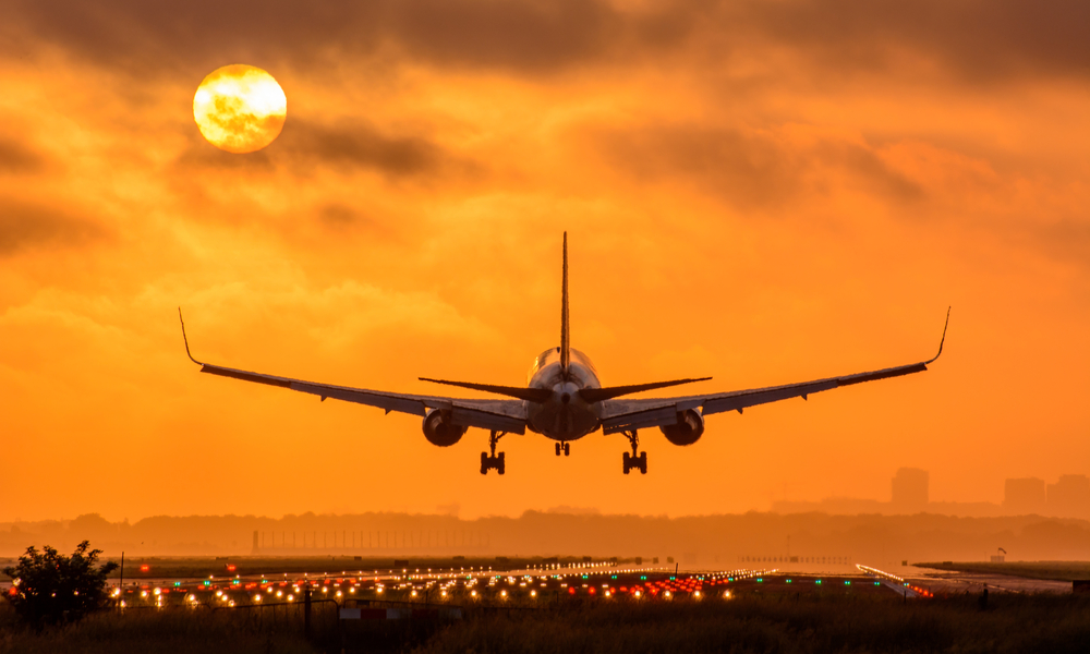 plane landing at dawn