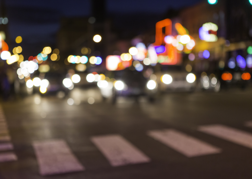 An abstract, horizontal image of a cross walk and traffic in a busy city. Could be any city, in this case, Nashville, TN. This is Broadway street in downtown Nashville. nashvilleabstractdowntownneontennesseebackgroundsbokehbroadwaybusycarscirclescitycolorfulcrosswalkdrivinglightlightsnightlifeofstreettrafficurbanShow more