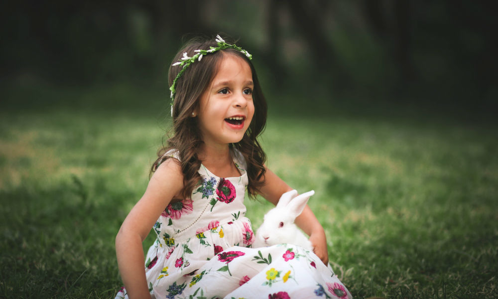 girl playing with a rabbit