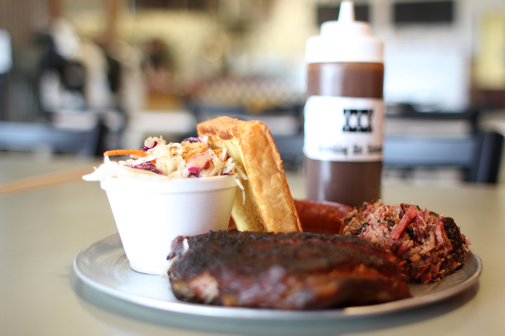 Barbecue plate with pork ribs, beef brisket, and Texas toast.