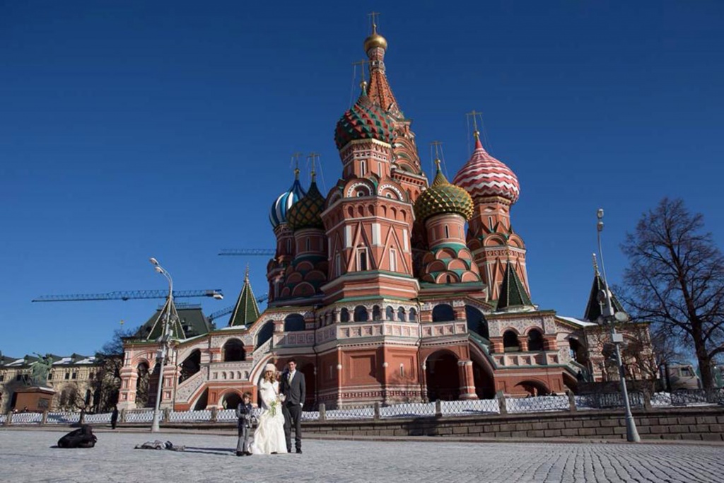 PIC FROM FORTITUDE PRESS (PICTURED - AMELIA AND BRETT GETTING MARRIED IN MOSCOW) A LOVED-UP couple whose wedding plans were dashed after they clashed with a family member’s marriage have gone on to tie the knot in EIGHT different countries. Amelia Irwin, 32, was faced with a dilemma after her wedding was planned in the same month as that of a family member of her partner Brett, 33, last year. But the couple, who met nine years ago, decided to tie the knot in a registry office so they could save £10,000 which they went on to use to travel the globe. And since they got married in Trowbridge last year, the couple have been blessed and enjoyed ceremonies at locations across the globe including Paris, Moscow, Beijing and Nepal. SEE FORTITUDE PRESS COPY