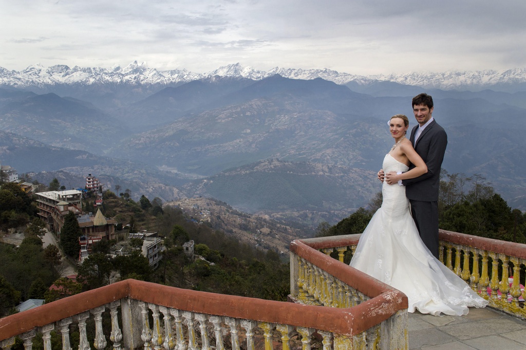 PIC FROM FORTITUDE PRESS (PICTURED - AMELIA AND BRETT GETTING MARRIED IN NEPAL, NEAR MOUNT EVEREST) A LOVED-UP couple whose wedding plans were dashed after they clashed with a family member’s marriage have gone on to tie the knot in EIGHT different countries. Amelia Irwin, 32, was faced with a dilemma after her wedding was planned in the same month as that of a family member of her partner Brett, 33, last year. But the couple, who met nine years ago, decided to tie the knot in a registry office so they could save £10,000 which they went on to use to travel the globe. And since they got married in Trowbridge last year, the couple have been blessed and enjoyed ceremonies at locations across the globe including Paris, Moscow, Beijing and Nepal. SEE FORTITUDE PRESS COPY