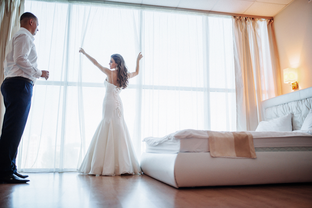 Wedding couple in hotel room