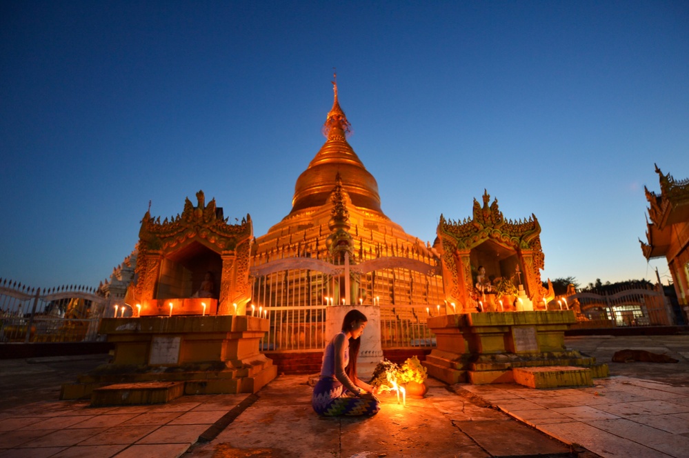 The beautiful woman Myanmar in Kuthodaw Pagoda on after sunset blue hour, treaditional culture myanmar,Mandalay Myanmar