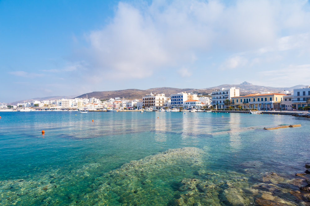 Tinos city and harbor in Cyclades against a blue sky, Greece