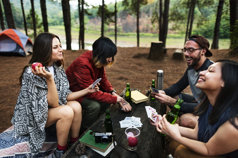 Group of Friends Hanging Playing Cards Together Concept