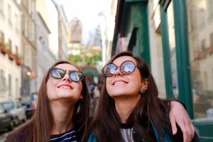 Happy beautiful student girls on the street