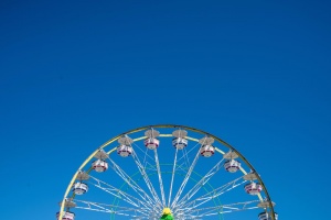 Carnival Ferris Wheel with Clean Skies with Empty Space Close up shot of half of a ferris wheel in Coachella California.