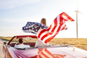 Family in car with American flag