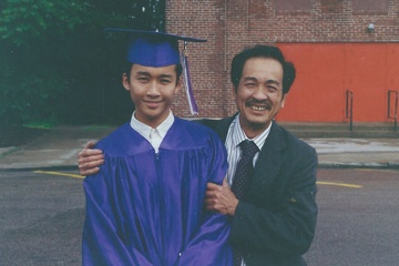 Kenneth and his father on his graduation day