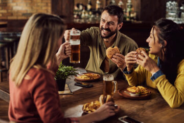 friends enjoying the best burgers in each state