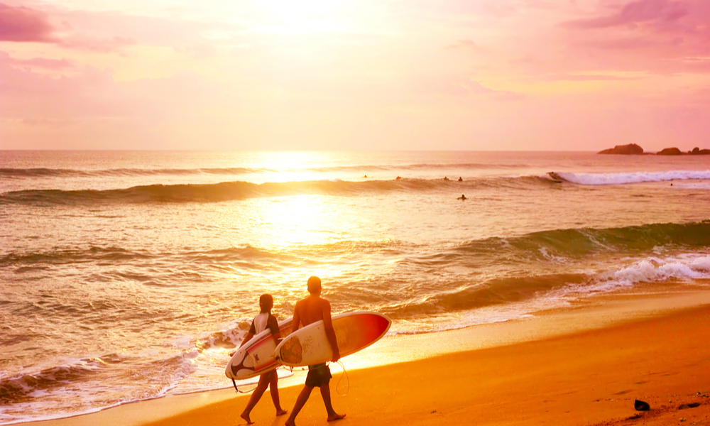 surfers in hikkaduwa, sri lanka