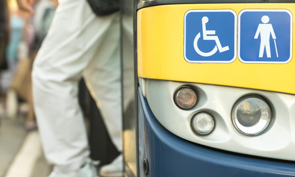 City bus. Signs with handicap symbols.