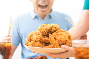 eating fried chicken