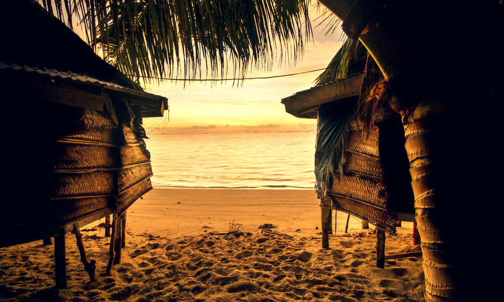 two huts on a beach