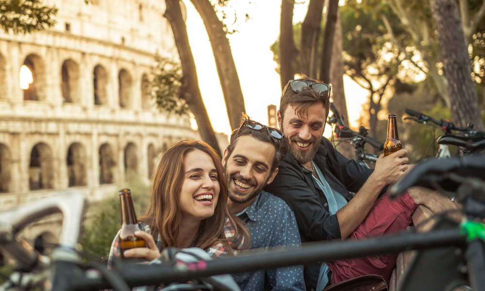 friends in Rome having a beer at sunset