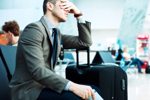 man upset because of delayed flight