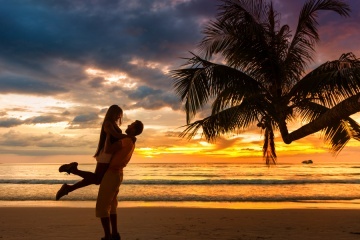 Couple enjoying valentine's Day trip to Fiji on the beach