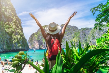 woman traveler enjoying the view of a forest