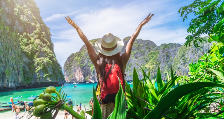 woman traveler enjoying the view of a forest