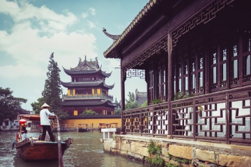 China traditional tourist boats at Shanghai Zhujiajiao town with boat and historic buildings, Shanghai China