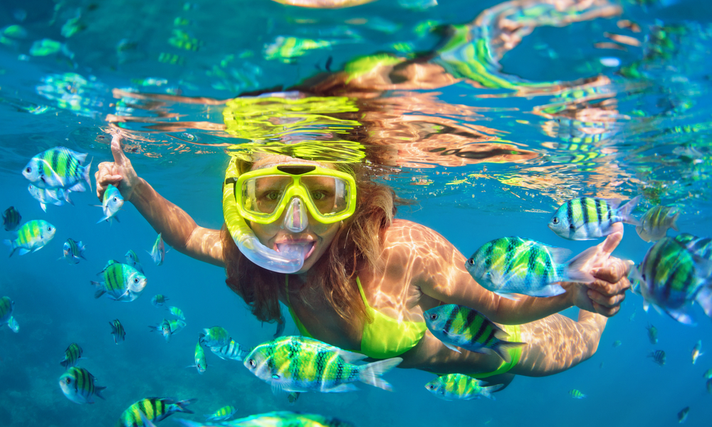 woman snorkeling in caribbean sea