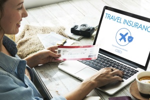 Woman looking at travel insurance online