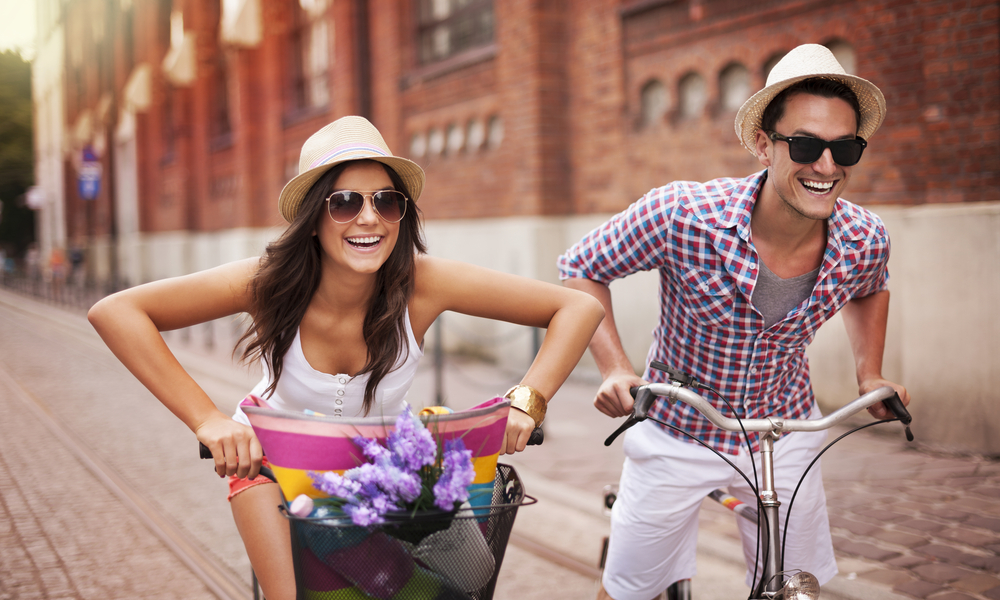 Couple riding bicycles in the city