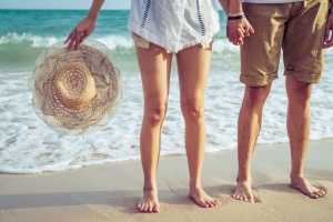 Couple standing together on the beach