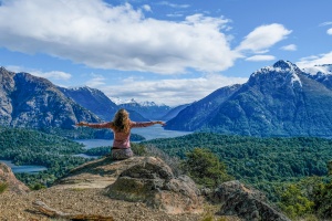 Woman sitting at the top of mountain in Argentina