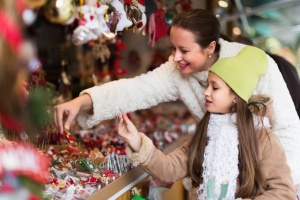 woman and young girl at a holiday market