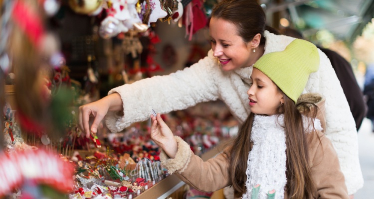 woman and young girl at a holiday market