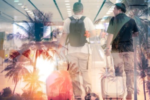 men traveling with palm trees in background