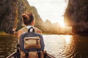 woman with backpack in a boat