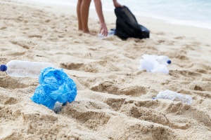 volunteer cleaning up on beach