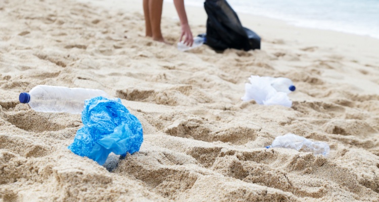 volunteer cleaning up on beach