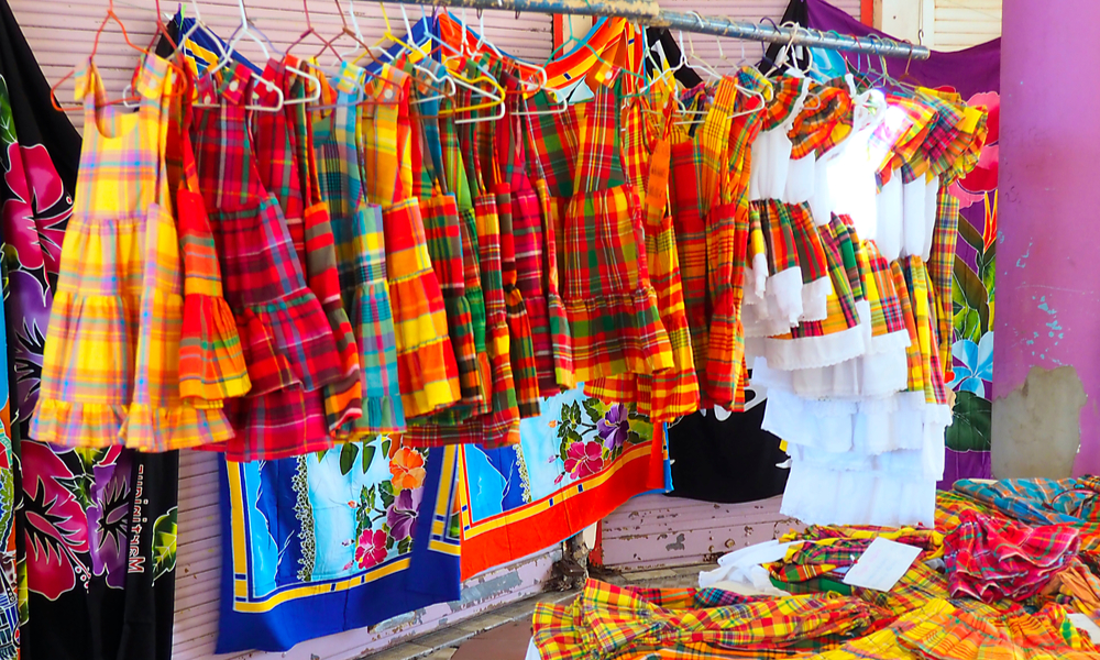 stand selling dresses made of madras on a market in Martinique.