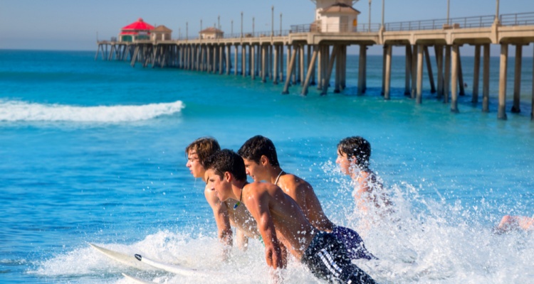 men surfing on huntington beach CA