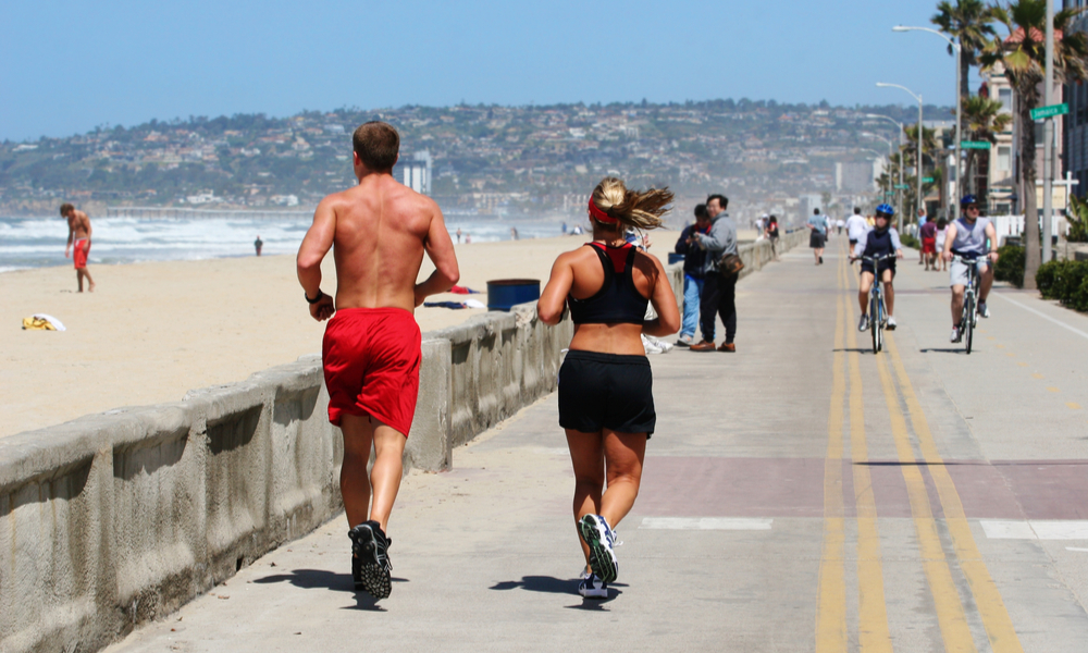 Couple running along the beach