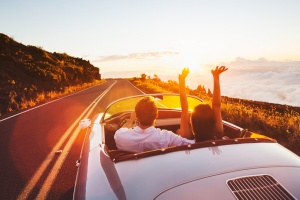 couple driving in convertible