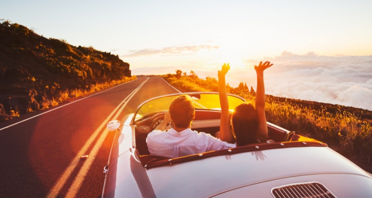 couple driving in convertible