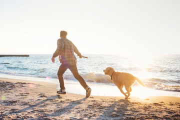 Man Running With Dog