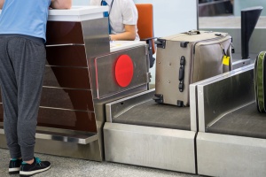 Luggage weighting at check-in desk at Asia airport