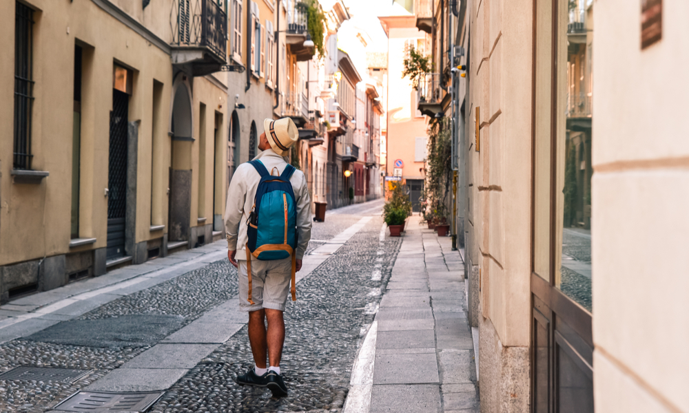 Young tourist man exploring the streets of Genova, Italy,