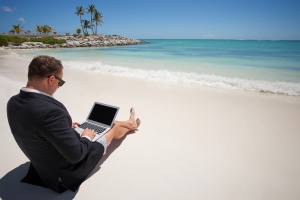 business man working on a beach