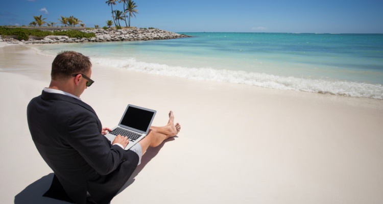 business man working on a beach