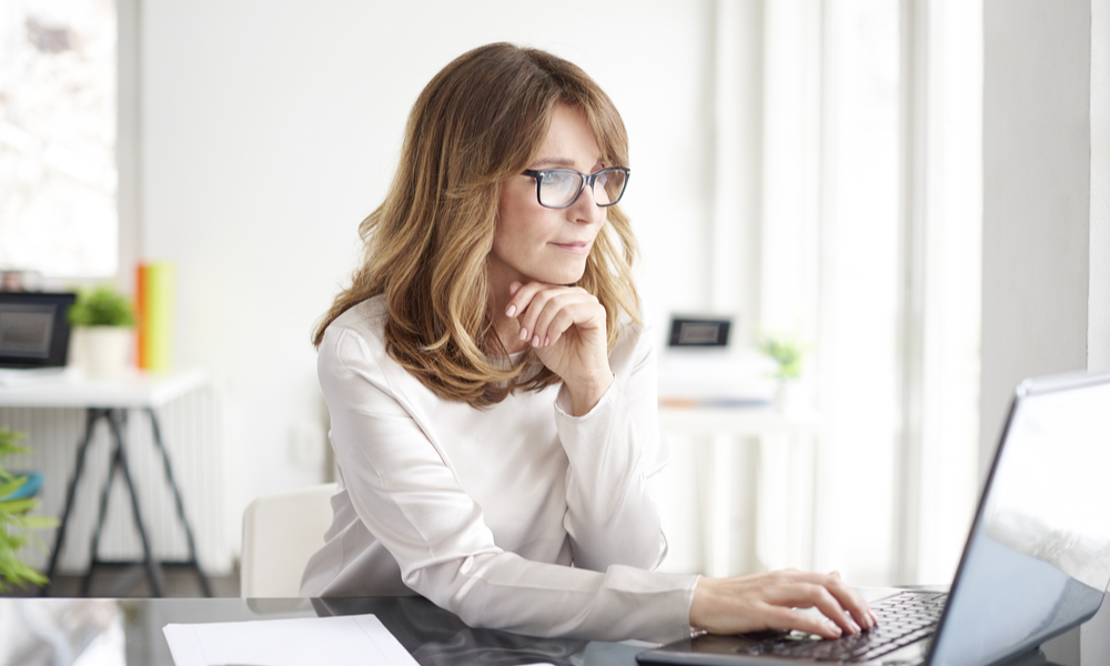 Shot of an attractive mature businesswoman working on laptop in her workstation