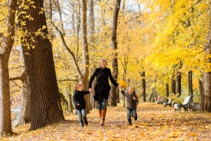 the best fall family vacations: family enjoying a fall destination